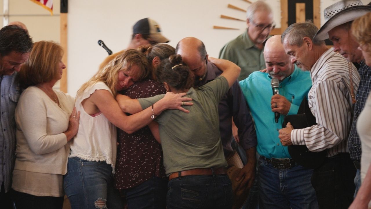 a group of people hugging each other